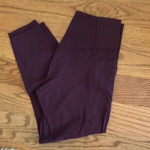 Athleta Salutation Stash Pocket Deep Purple Leggings